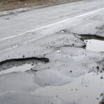 How Road Hazards Like Potholes and Debris Cause Motorcycle Accidents
