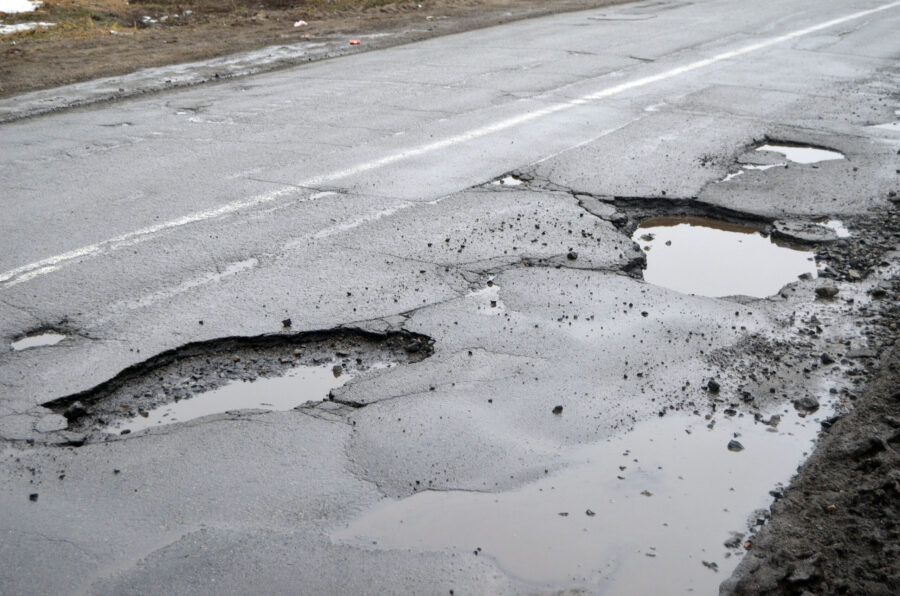 How Road Hazards Like Potholes and Debris Cause Motorcycle Accidents